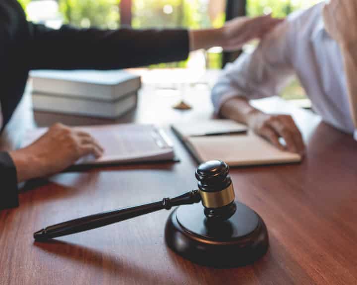 professional lawyer discussing legal options and solutions with a client in Plano